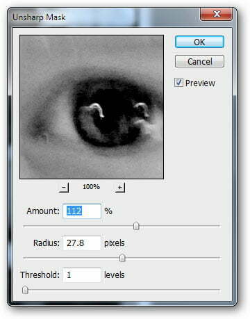 Filters > Sharpen > Unsharp Mask.